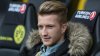 469528107-injured-marco-reus-of-dortmund-sits-on-the-bench-while.jpg