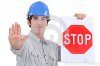 builder-holding-stop-sign-28009677.jpg